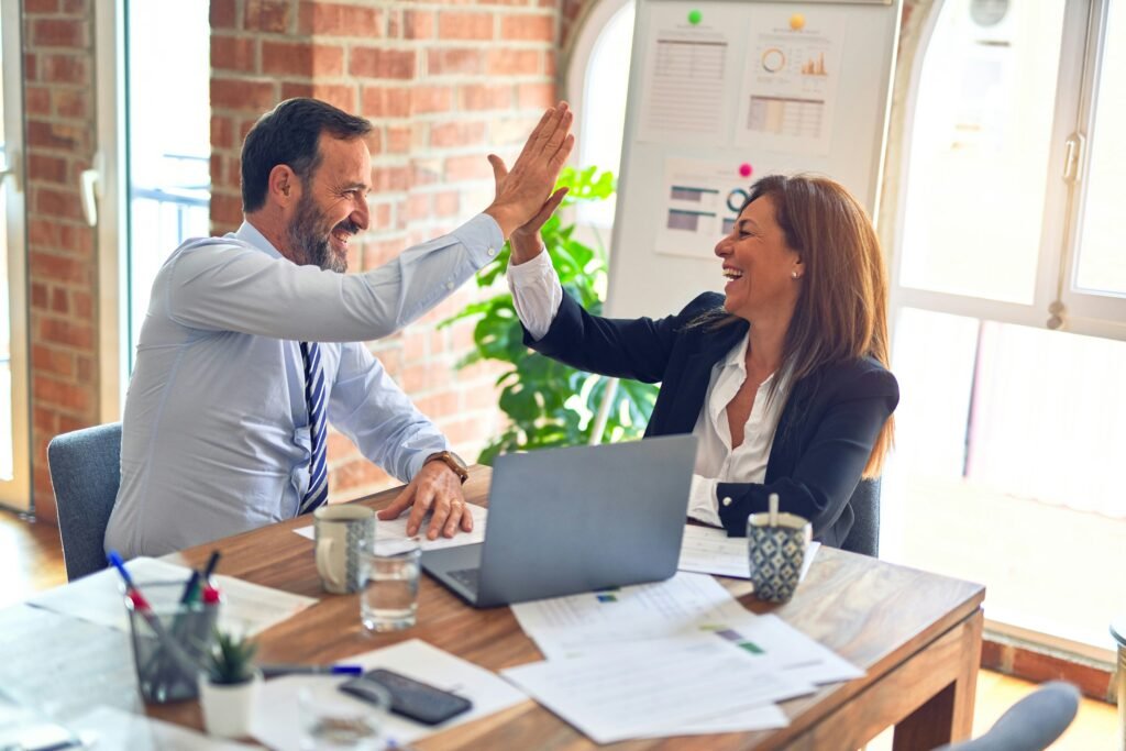 Marketing team celebrating business growth success
