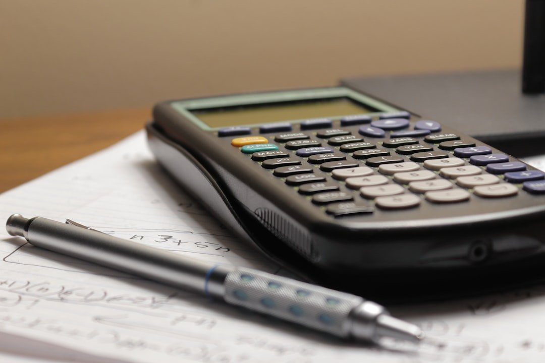 Calculator and financial numbers used to track marketing metrics